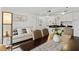 Open concept kitchen and dining area with white cabinets and a breakfast bar at 6165 Carrier Dr # 1206, Orlando, FL 32819