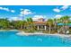 Community pool with a cabana, offering a shady spot to relax by the water at 4114 Breakview Dr # 406, Orlando, FL 32819