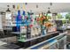 A well-stocked poolside bar with various liquors and mixers at 4114 Breakview Dr # 406, Orlando, FL 32819