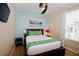 Bedroom with a queen bed and ceiling fan, light blue and beige walls at 4114 Breakview Dr # 406, Orlando, FL 32819
