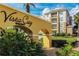 Resort entrance with a welcoming sign and landscaping at 4114 Breakview Dr # 406, Orlando, FL 32819