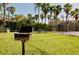 Community grilling area with picnic table and basketball court nearby at 4114 Breakview Dr # 406, Orlando, FL 32819