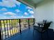 Spacious balcony overlooking a scenic landscape and parking area at 4114 Breakview Dr # 406, Orlando, FL 32819