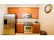 Modern kitchen with stainless steel appliances and light wood cabinets at 4114 Breakview Dr # 406, Orlando, FL 32819
