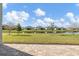 Spacious backyard with pond views and brick patio at 815 Liliana Dr, Deland, FL 32724
