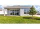 House exterior with covered patio and green lawn at 815 Liliana Dr, Deland, FL 32724