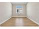 Bright and airy home office with wood-look flooring and large window at 815 Liliana Dr, Deland, FL 32724