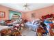 Bedroom with light pink walls and ample closet space at 4256 Fort Courage Cir, Kissimmee, FL 34746