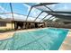 Large screened-in pool with plenty of space for relaxation at 4256 Fort Courage Cir, Kissimmee, FL 34746