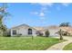House with a large yard and driveway at 5920 Norvale Ct, Orlando, FL 32808