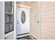Front entrance with white door and stained-glass window at 5920 Norvale Ct, Orlando, FL 32808