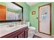 Bathroom features a vanity, toilet, shower, and exterior access at 5920 Norvale Ct, Orlando, FL 32808
