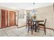 View of dining area with table and chairs near entryway and closet at 5920 Norvale Ct, Orlando, FL 32808