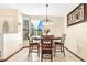 Dining area with round table and chairs, near entryway and window at 5920 Norvale Ct, Orlando, FL 32808