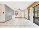 Common area with tiled floor, ceiling fan, and access to backyard at 5920 Norvale Ct, Orlando, FL 32808