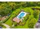 Community pool with lounge chairs and adjacent covered structure at 316 Shelbourne Loop, Kissimmee, FL 34759