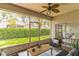 Relaxing screened patio with seating area, overlooking backyard at 316 Shelbourne Loop, Kissimmee, FL 34759
