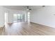Spacious living room with sliding glass doors and wood-look floors at 316 Shelbourne Loop, Kissimmee, FL 34759