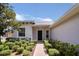 Front view of a single-story house with a walkway at 316 Shelbourne Loop, Kissimmee, FL 34759