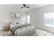 Bedroom with a king-size bed, two nightstands and large windows at 316 Shelbourne Loop, Kissimmee, FL 34759
