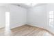 Bright dining room with wood-look floors and an arched doorway at 316 Shelbourne Loop, Kissimmee, FL 34759