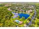 Aerial view of a community with a lake and pool at 316 Shelbourne Loop, Kissimmee, FL 34759