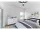 Bedroom with a queen-size bed, dresser, and window at 316 Shelbourne Loop, Kissimmee, FL 34759