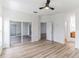 Bright bedroom with wood-look floors and sliding glass doors leading to a patio at 316 Shelbourne Loop, Kissimmee, FL 34759