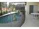Screened pool area with patio furniture at 346 Kildrummy Dr, Davenport, FL 33896