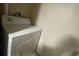 Stackable washer and dryer in a small laundry room at 1073 S Hiawassee Rd # 1018, Orlando, FL 32835