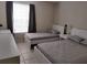 Two twin beds in a well-lit bedroom with ample space at 1073 S Hiawassee Rd # 1018, Orlando, FL 32835