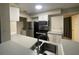 Modern kitchen with stainless steel appliances and gray counters at 1073 S Hiawassee Rd # 1018, Orlando, FL 32835