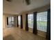 Living room with sliding door to patio and large windows at 1073 S Hiawassee Rd # 1018, Orlando, FL 32835