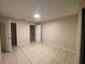 Bright bedroom with tile flooring and a large closet at 1073 S Hiawassee Rd # 1018, Orlando, FL 32835