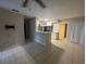 Open kitchen with breakfast bar and view to living room at 1073 S Hiawassee Rd # 1018, Orlando, FL 32835