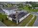 Aerial view of house showcasing solar panels and screened patio at 1839 Good Neighbor Loop, Kissimmee, FL 34744