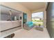 Relaxing screened porch with outdoor seating overlooking backyard at 1839 Good Neighbor Loop, Kissimmee, FL 34744