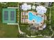 Community pool with surrounding lounge chairs and landscaping at 1839 Good Neighbor Loop, Kissimmee, FL 34744