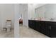 Clean bathroom with double vanity and toilet, bedroom view at 1839 Good Neighbor Loop, Kissimmee, FL 34744