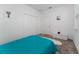Simple bedroom with teal bedding and double door closet at 1839 Good Neighbor Loop, Kissimmee, FL 34744