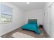 Cozy bedroom with teal bedding and ample closet space at 1839 Good Neighbor Loop, Kissimmee, FL 34744