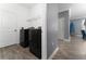 Bright laundry room features modern washer and dryer, and ample storage at 1839 Good Neighbor Loop, Kissimmee, FL 34744