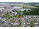 Aerial view showing home's location in a community with pool, tennis courts, and lake at 1839 Good Neighbor Loop, Kissimmee, FL 34744