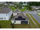 Aerial view of house with solar panels and backyard at 1839 Good Neighbor Loop, Kissimmee, FL 34744