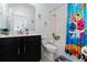 Stylish bathroom with dark vanity, bathtub and shark theme at 1839 Good Neighbor Loop, Kissimmee, FL 34744