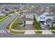 Aerial view of a house with solar panels in a residential neighborhood at 1839 Good Neighbor Loop, Kissimmee, FL 34744