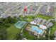 Aerial view showing home and community amenities such as pool and tennis courts at 1839 Good Neighbor Loop, Kissimmee, FL 34744