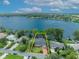 Lakefront property offering breathtaking water views and lush landscaping at 279 Rippling Ln, Winter Park, FL 32789