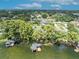 Bird's-eye view of a lakefront home with private dock and boat lift at 279 Rippling Ln, Winter Park, FL 32789