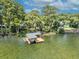 Lakefront dock with boathouse and plenty of space for relaxation at 279 Rippling Ln, Winter Park, FL 32789